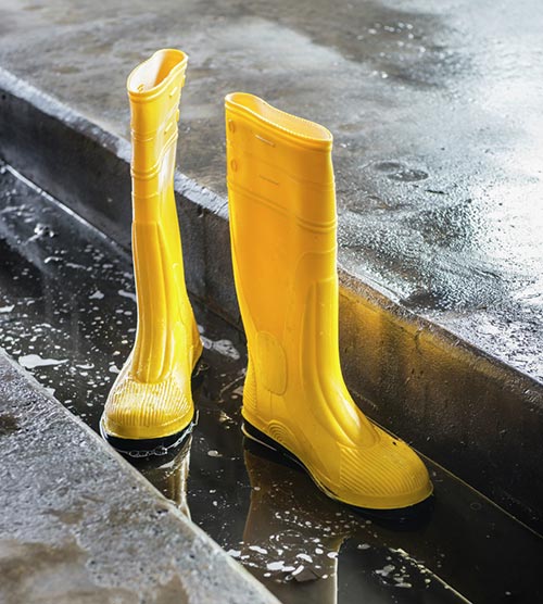 Stivale da lavoro giallo in gomma funzionamento battuta ...
